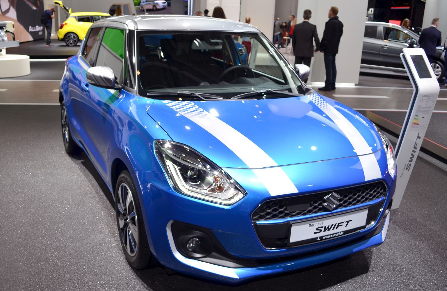 Front angle of a compact hatchback with racing stripes