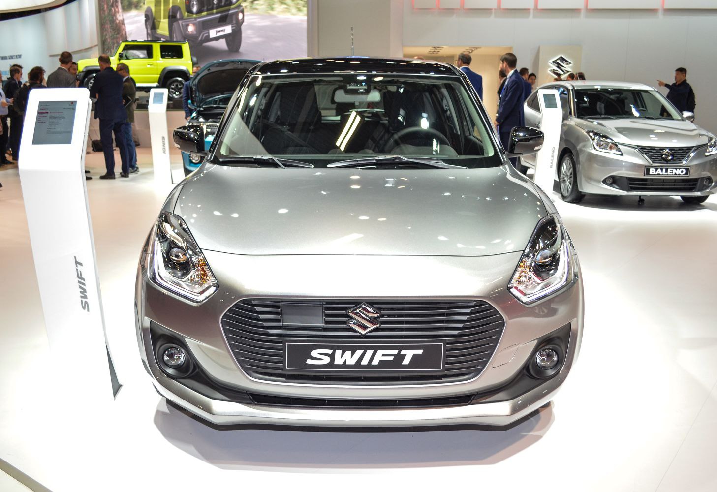 Close-up front view of Suzuki Swift VI with grille and lights