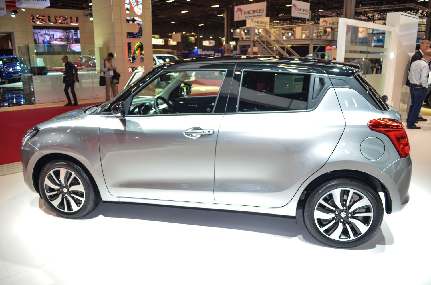 Silver compact hatchback side view with two-tone roof and alloy wheels