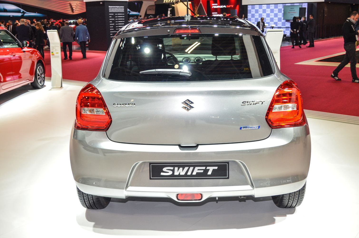 Compact hatchback rear with distinctive tail lights and hybrid badge