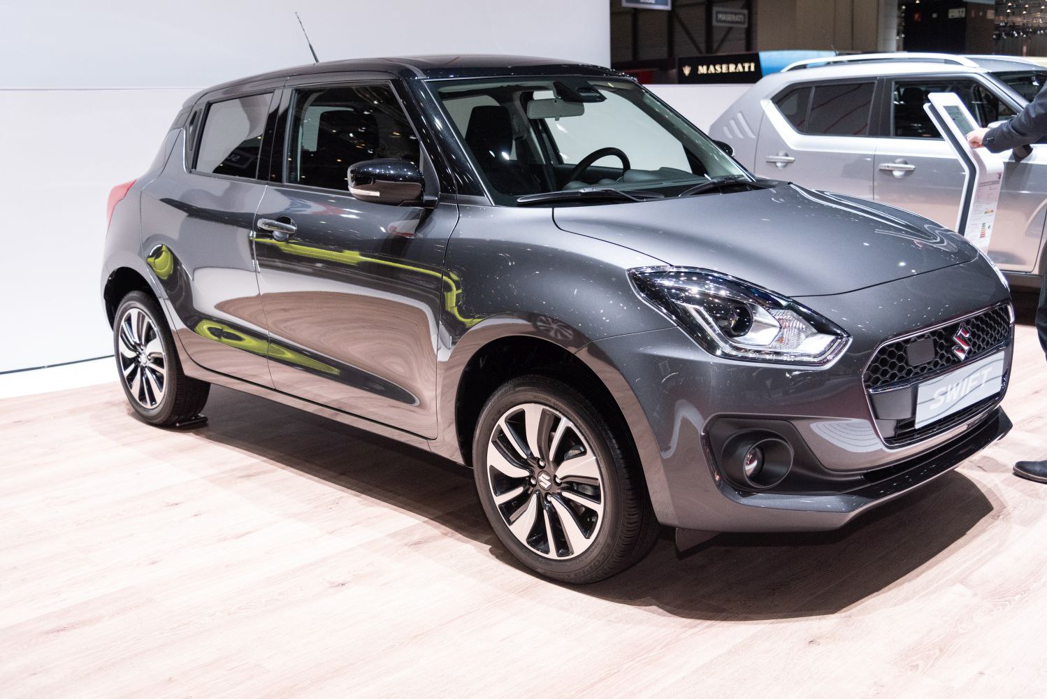 Compact hatchback with sharp headlights and alloy wheels