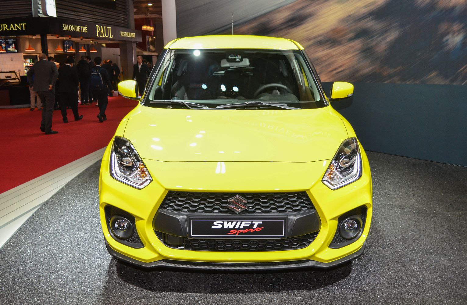 Front view of a compact hatchback with sport grille and fog lights