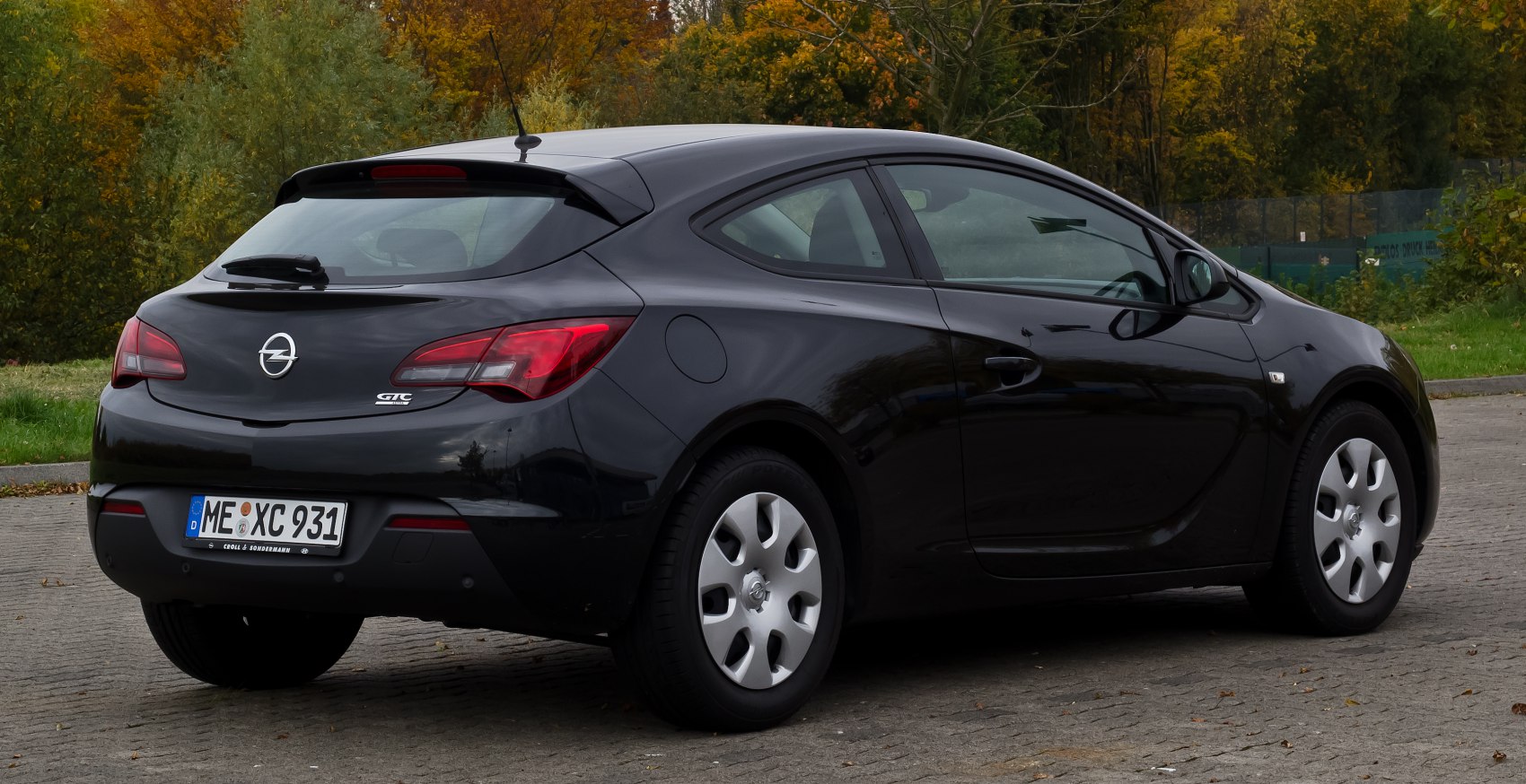 Black compact hatchback rear and side profile with distinct tail lights