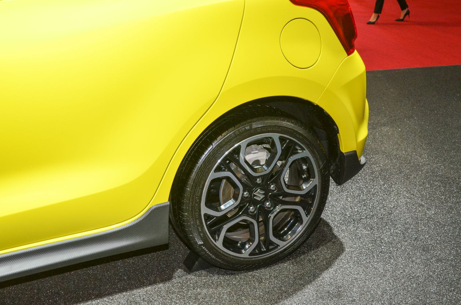 Close-up of alloy wheel and rear body panel with fuel filler cap
