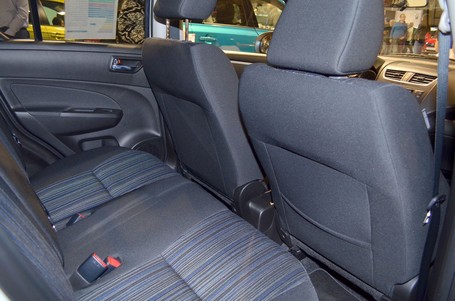 Rear seat fabric upholstery and door panel in compact car interior