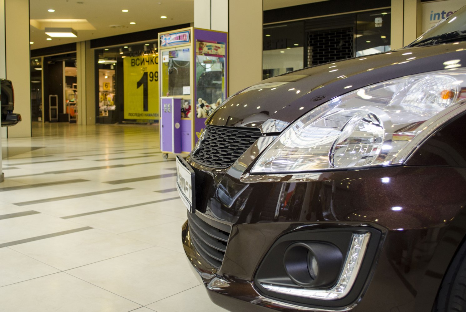 Close-up of front grille and headlight with fog light and LED strip