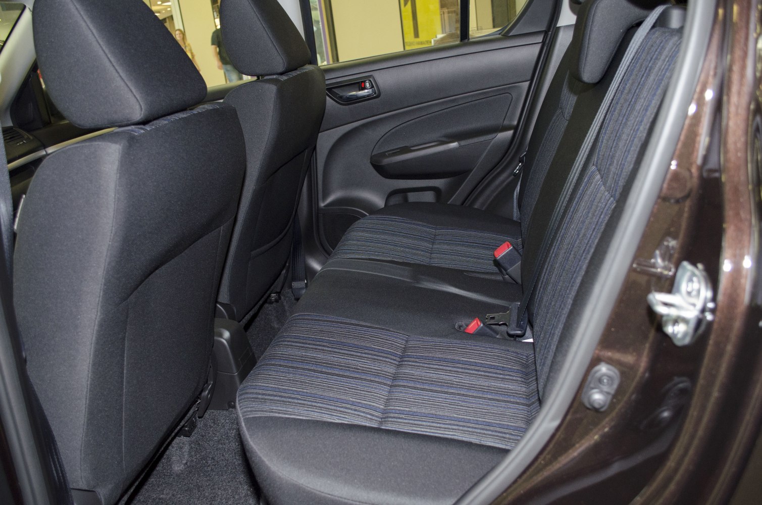 Rear passenger seats and door panel upholstery in a vehicle interior