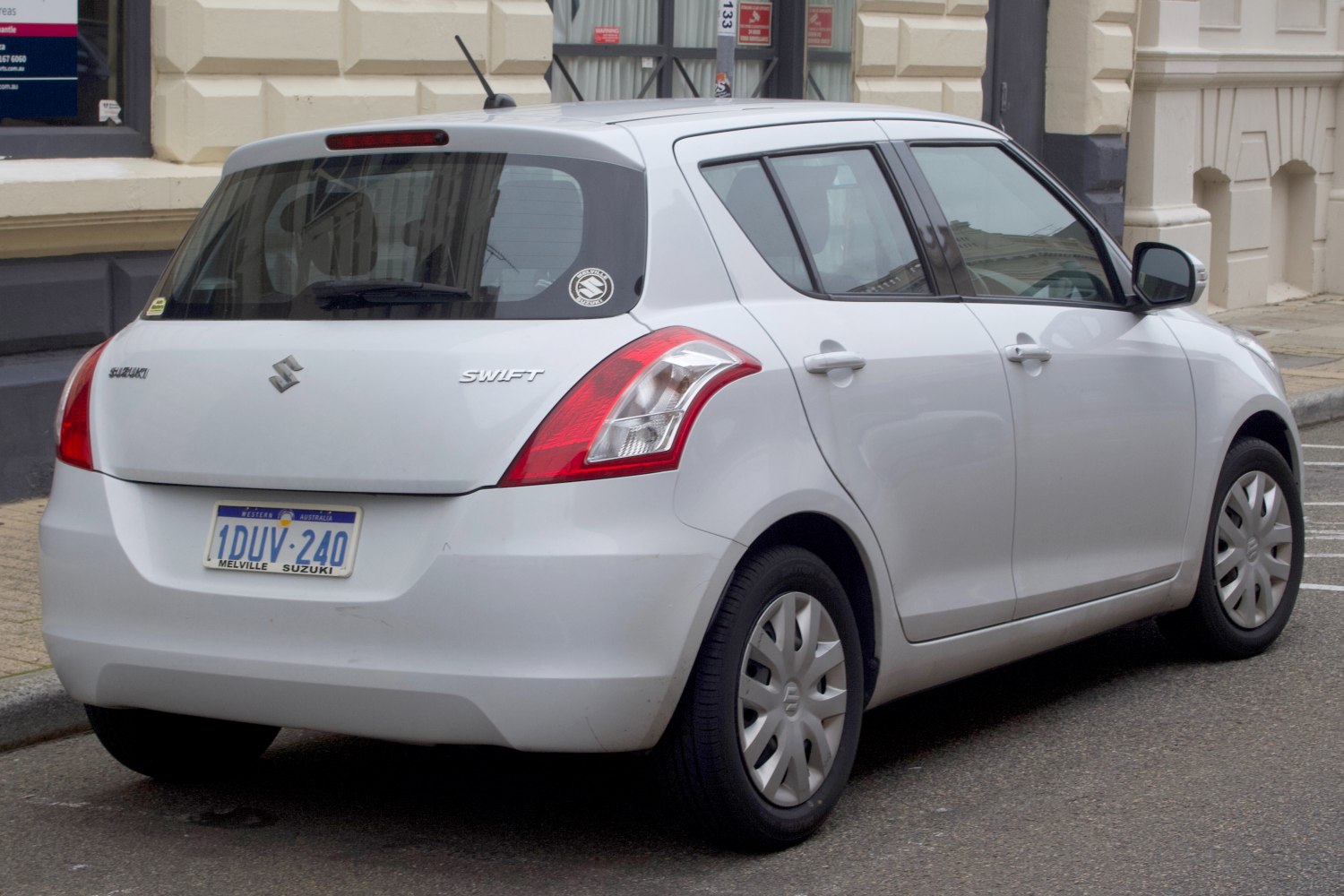 Rear view of a compact five-door hatchback with distinct tail lights
