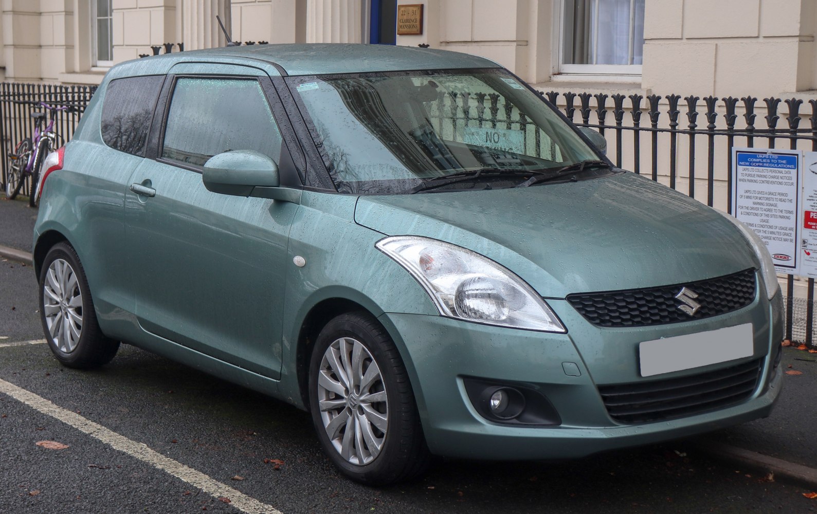 Front three-quarter view of compact hatchback with alloy wheels and modern headlights
