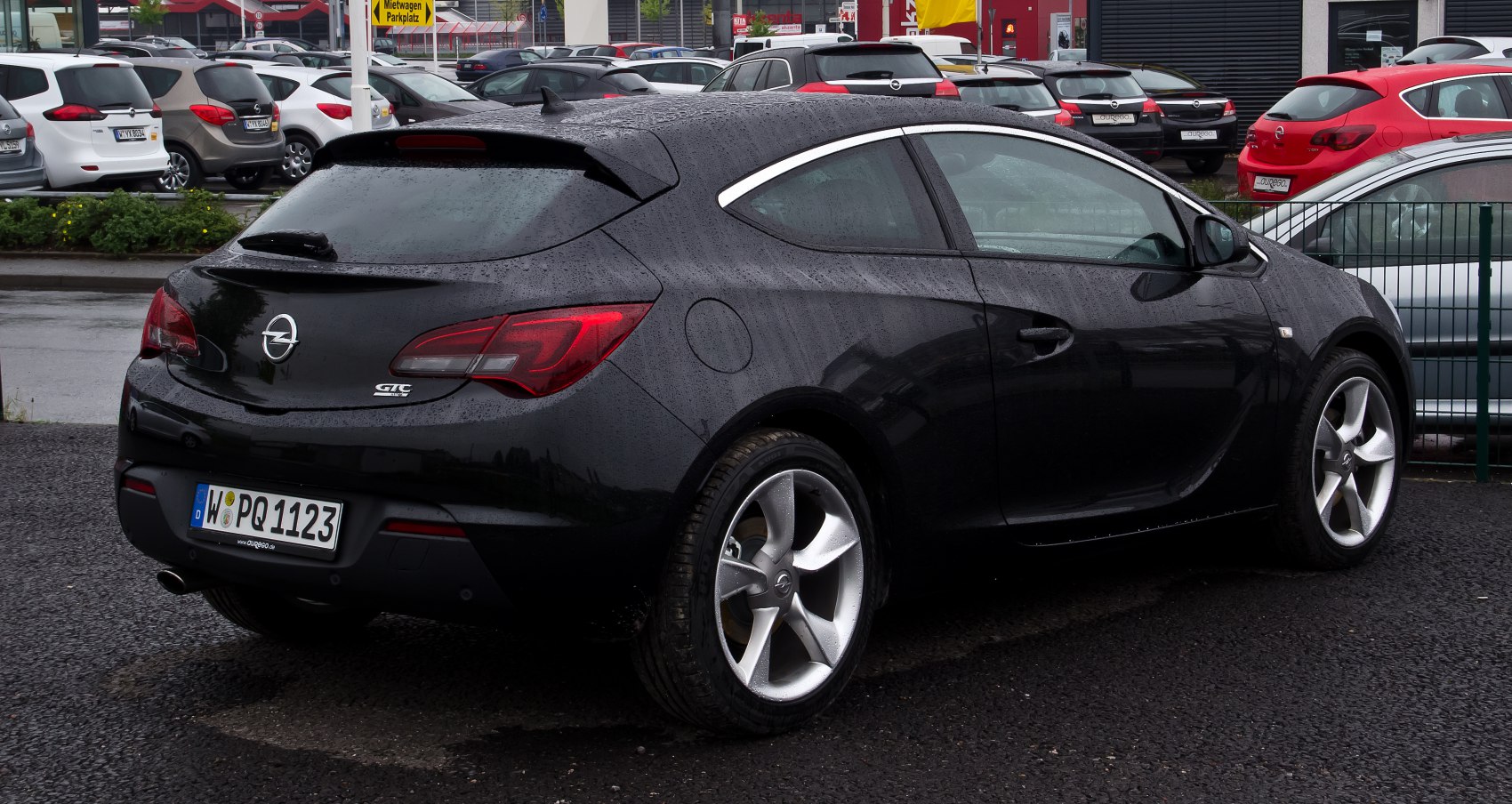 Rear side view of black hatchback with alloy wheels