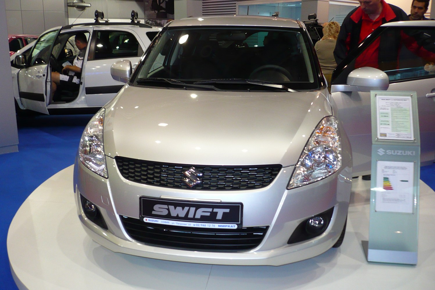 Front view with distinctive headlights, grille, and fog lamps