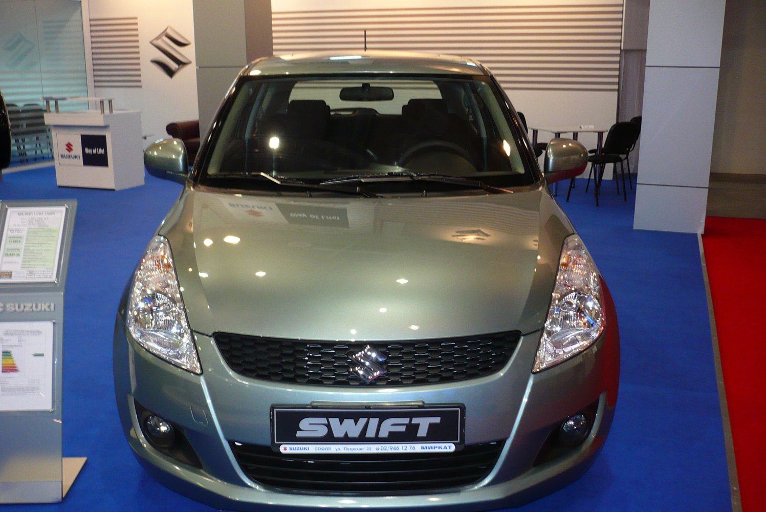 Front view of hatchback with headlights and grille