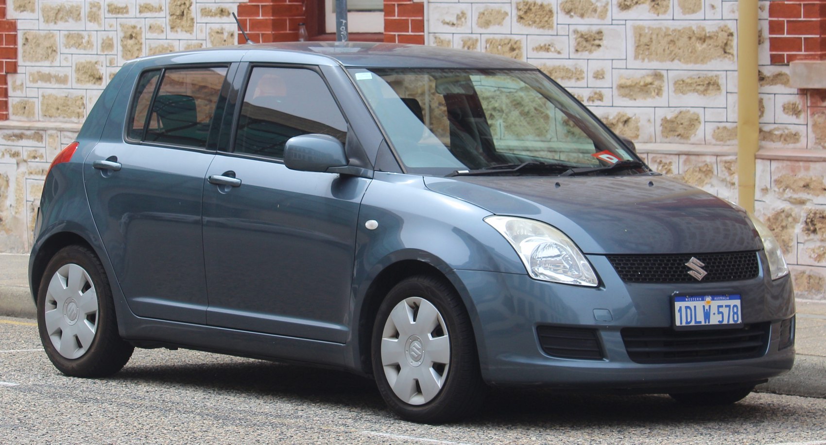 Compact hatchback with smooth curves and tinted windows
