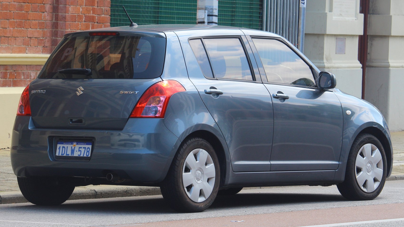 Rear and side view of compact hatchback with distinctive taillights
