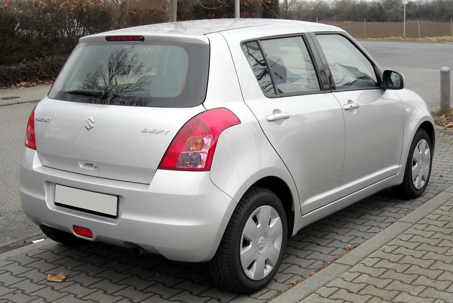 Silver hatchback with distinctive rear lights and five doors