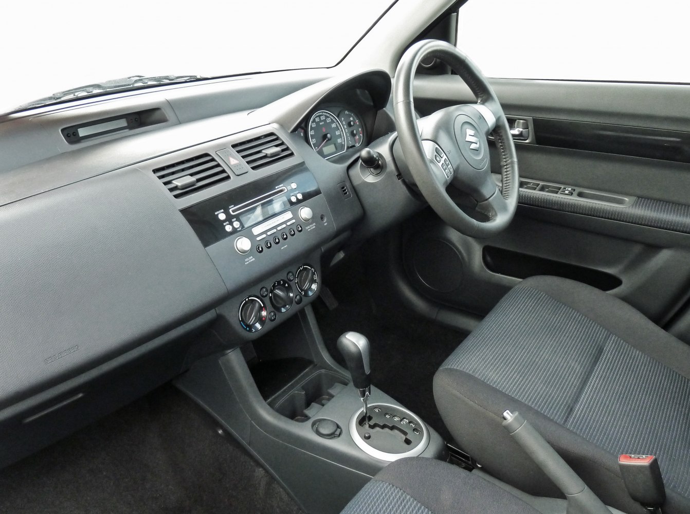 Dashboard and automatic gear shift in compact car interior