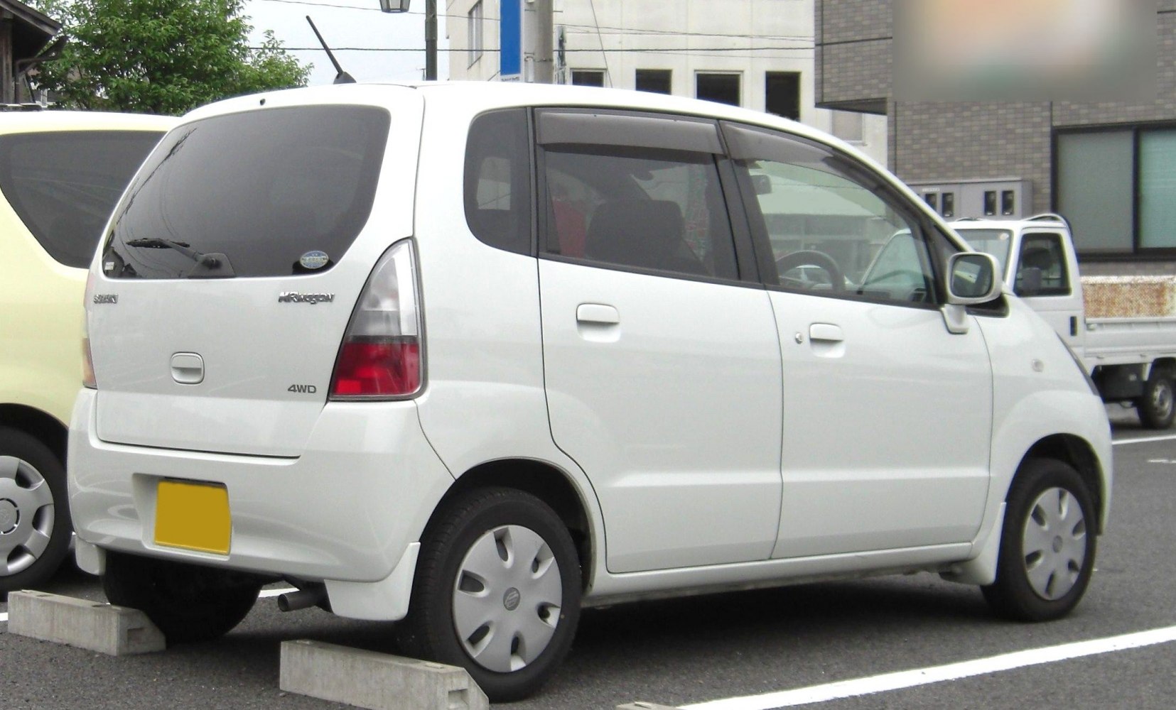 Rear and side view of compact hatchback with 4WD badge and distinctive taillights