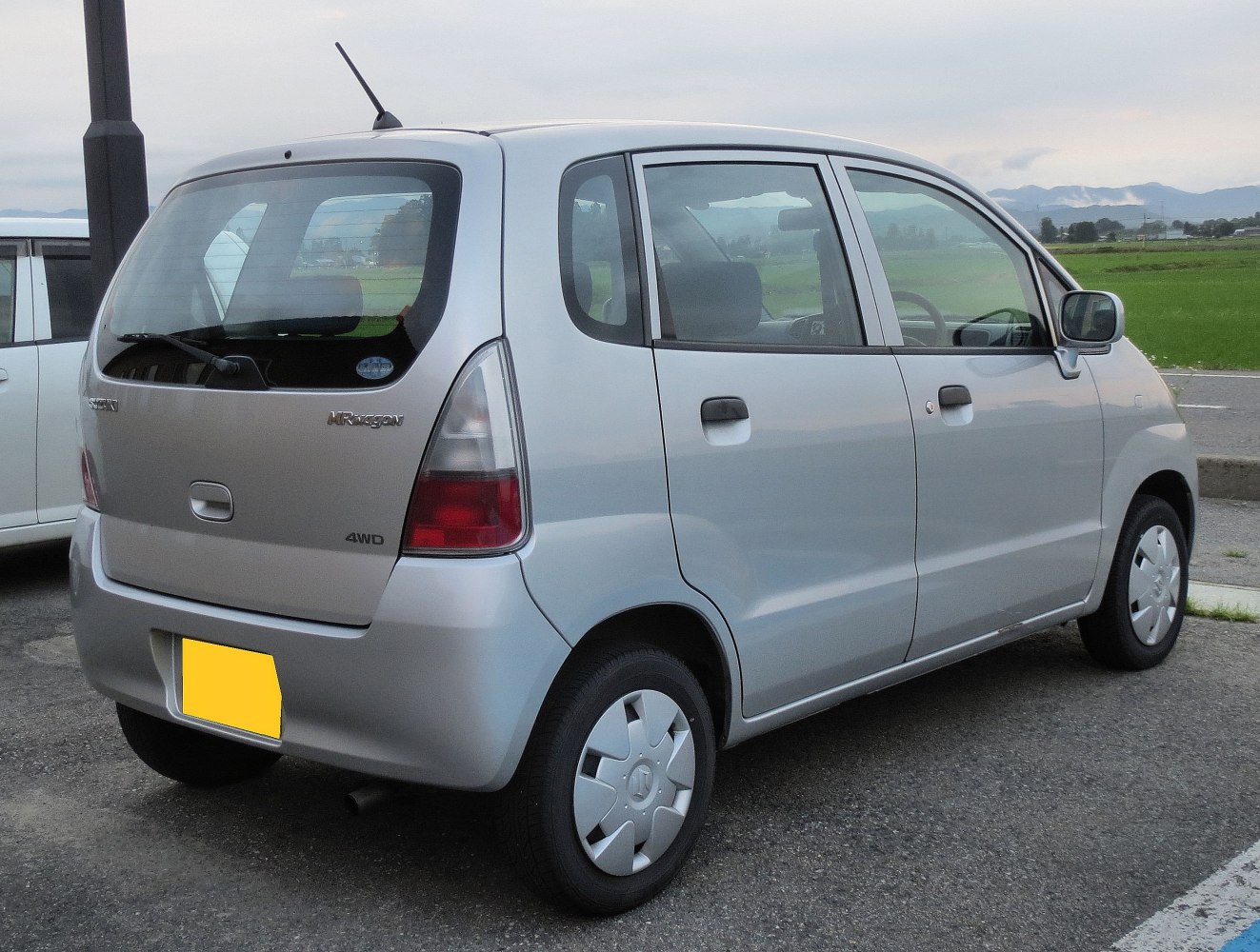 Compact silver 4WD hatchback rear and side view
