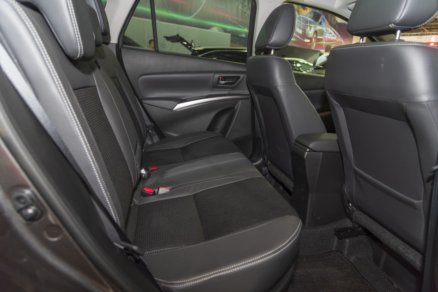 Spacious rear seating with black upholstery and modern door panel