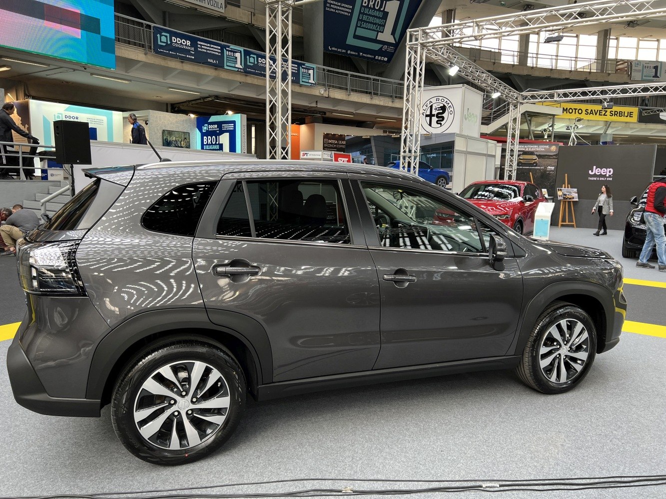 Sleek side profile with sharp lines and alloy wheels