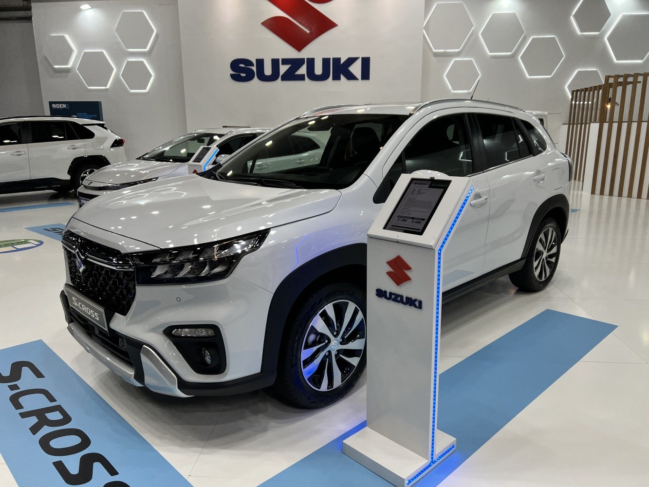 White SUV with bold front grille and modern alloy wheels