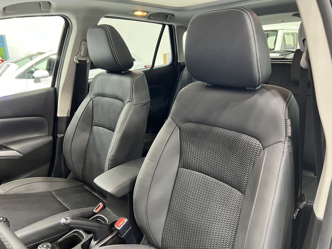 Front seats with detailed upholstery and stitching