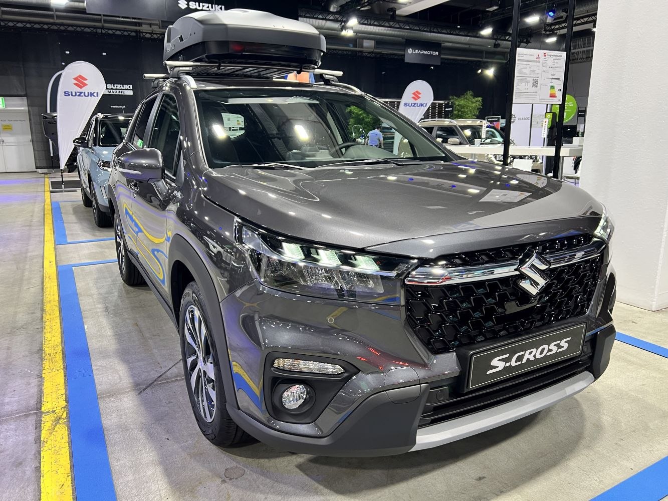 LED headlights and roof cargo box on a modern crossover front