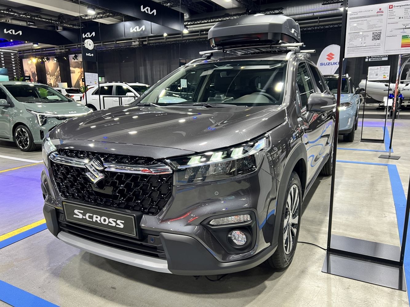 Front view of SUV with LED headlights, bold grille, and roof box