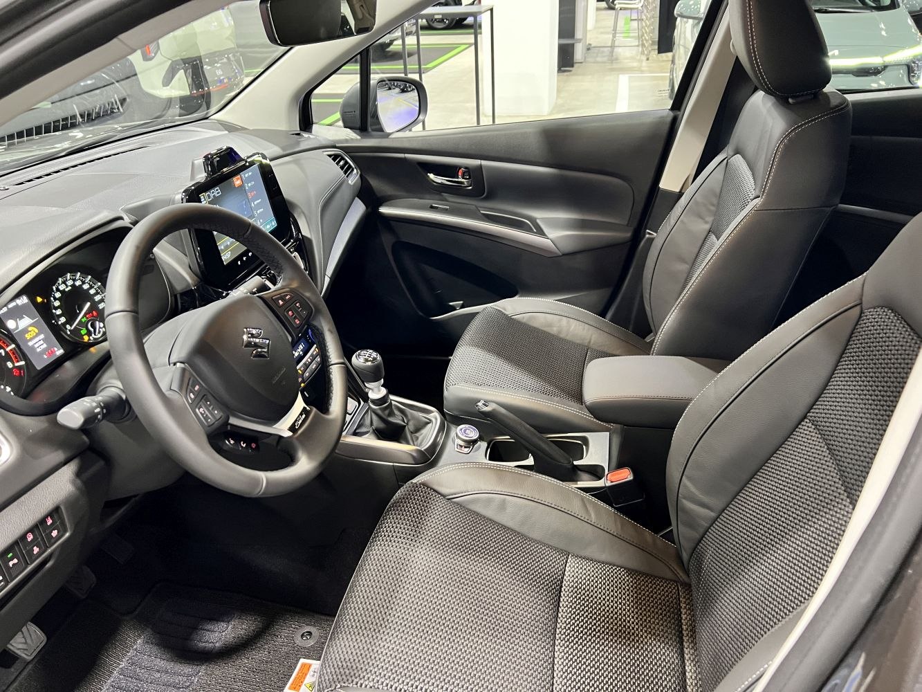 Modern car interior with touchscreen and manual transmission