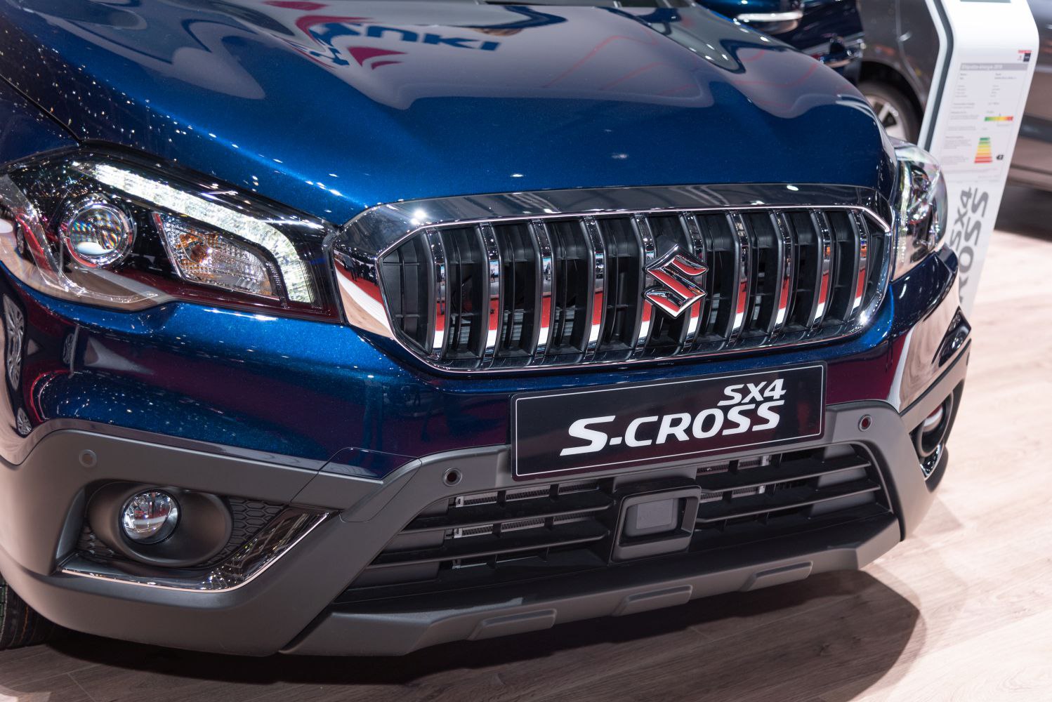 Close-up of front grille and headlight with fog light