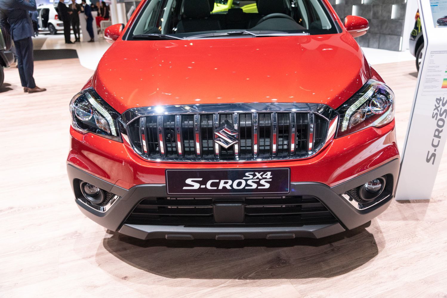 Front grille and headlights of red crossover SUV