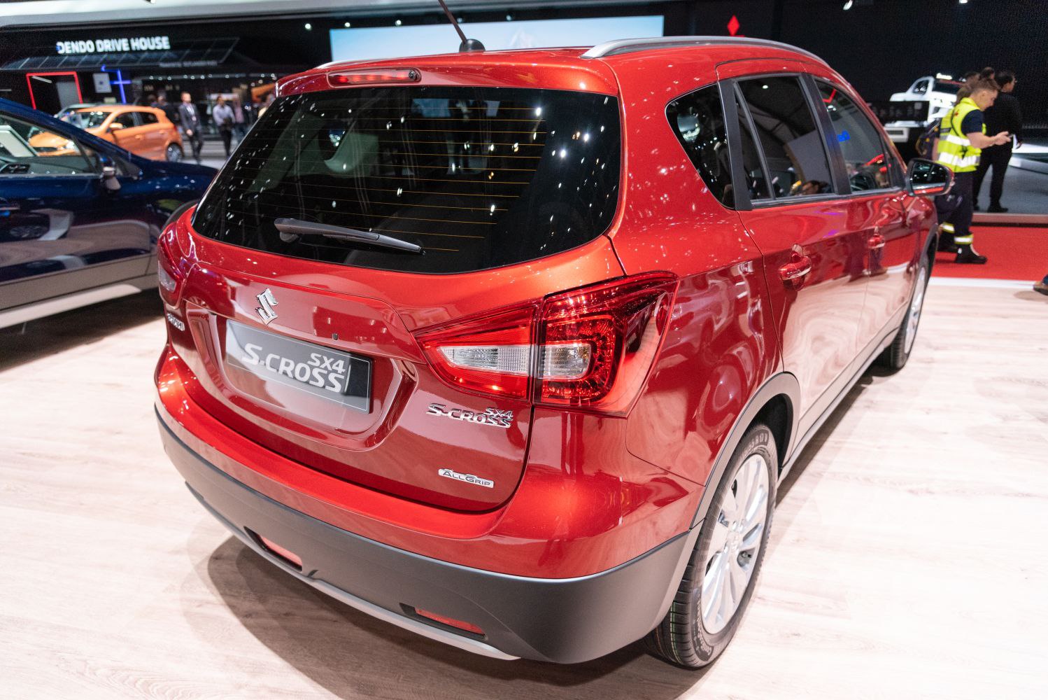 Rear view of a red SUV with distinctive taillights and AllGrip badge