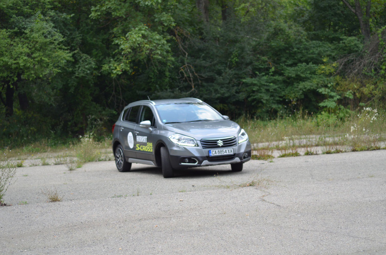 Front and side view of compact SUV with wide grille and sharp headlights
