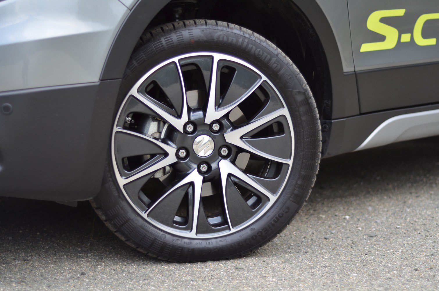 Stylish alloy rim and tire close-up with unique multi-spoke design.