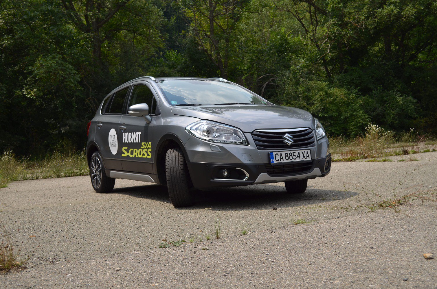 Gray compact SUV front three-quarter view with test drive decal