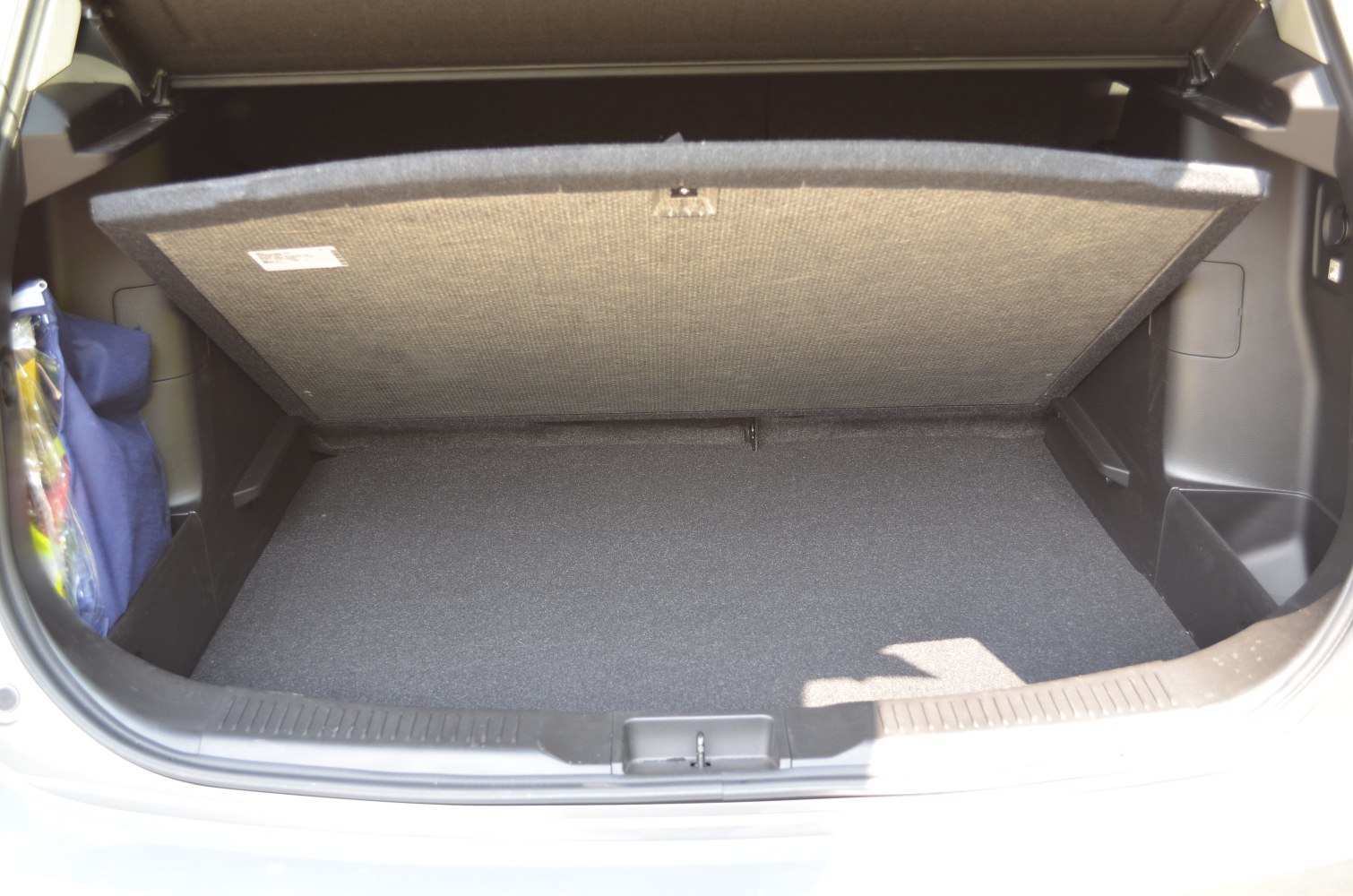 Spacious and organized car trunk interior with exposed under-floor panel