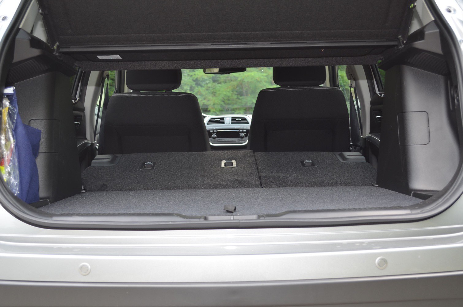 Folded rear seats with spacious cargo area in vehicle trunk