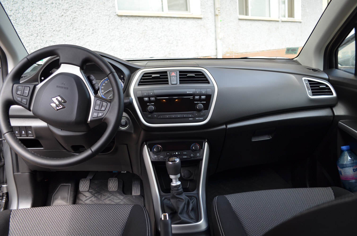 Dashboard with manual gear shift and steering wheel controls