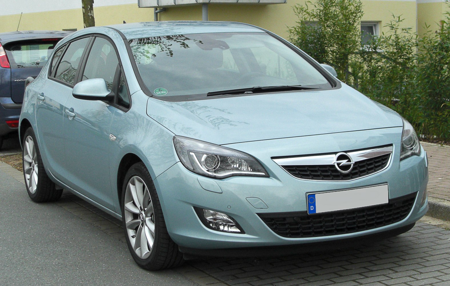 Front view with distinctive headlights and grille