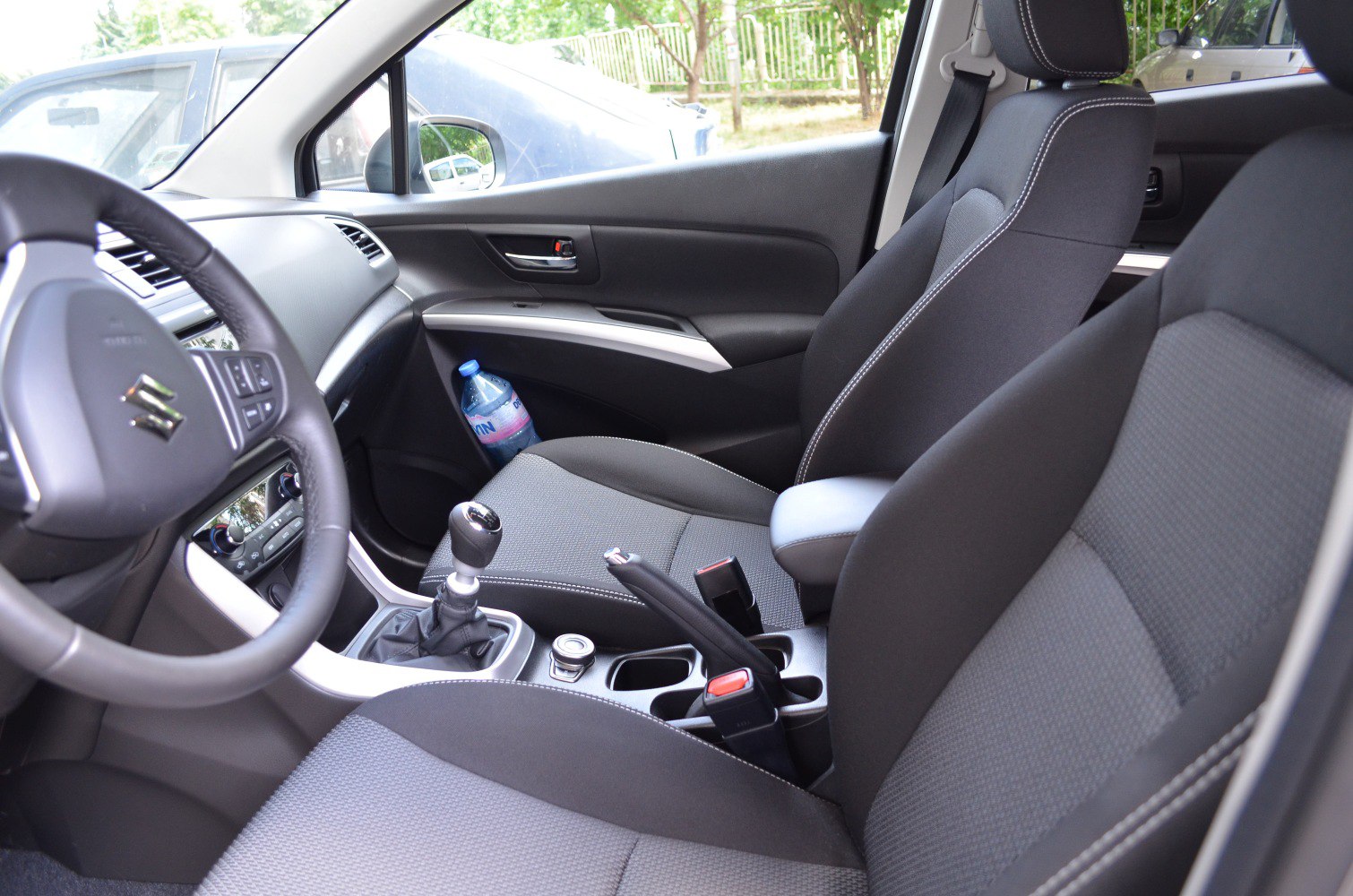 Suzuki compact SUV interior with manual gear shift and ergonomic seats