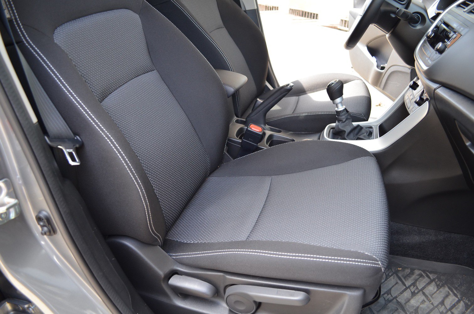 Front seat upholstery and manual gear shift of vehicle interior