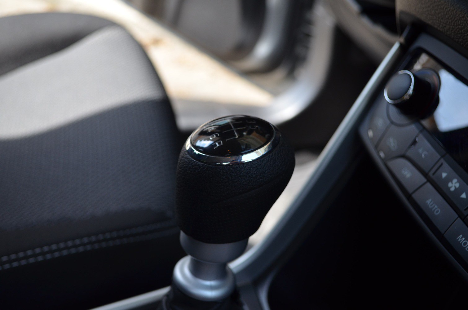 Manual transmission gear shift knob with visible gear pattern