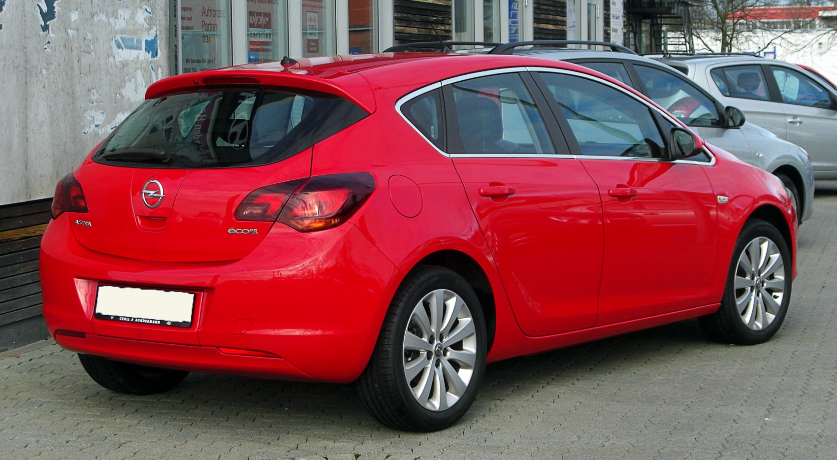 Red hatchback rear view with sleek taillights and ecoFLEX badge