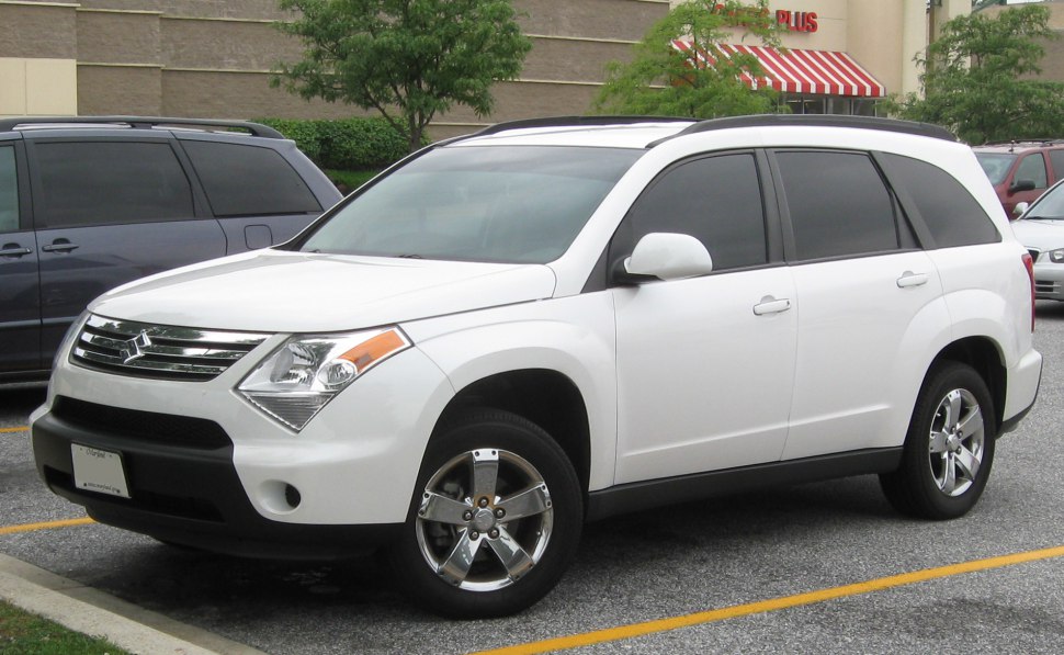 White SUV front side with grille, alloy wheels, and tinted windows