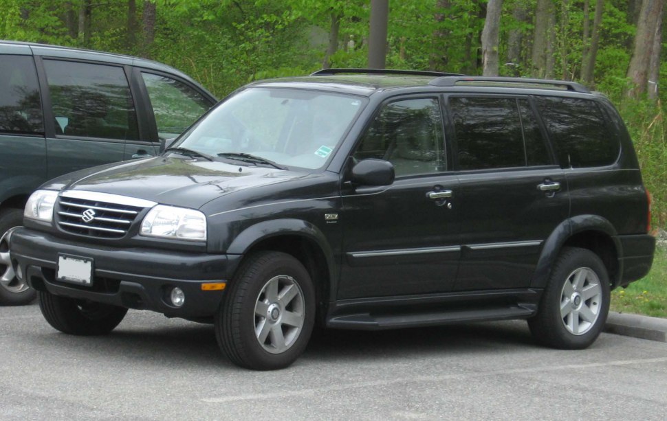 Black SUV with roof rails and modern grille design