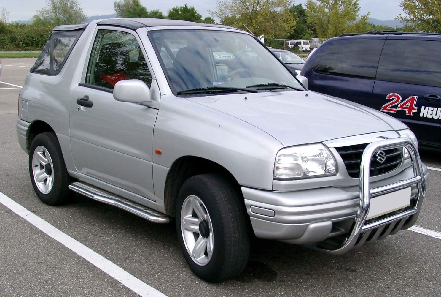 Two-door SUV with bull bar and soft top roof