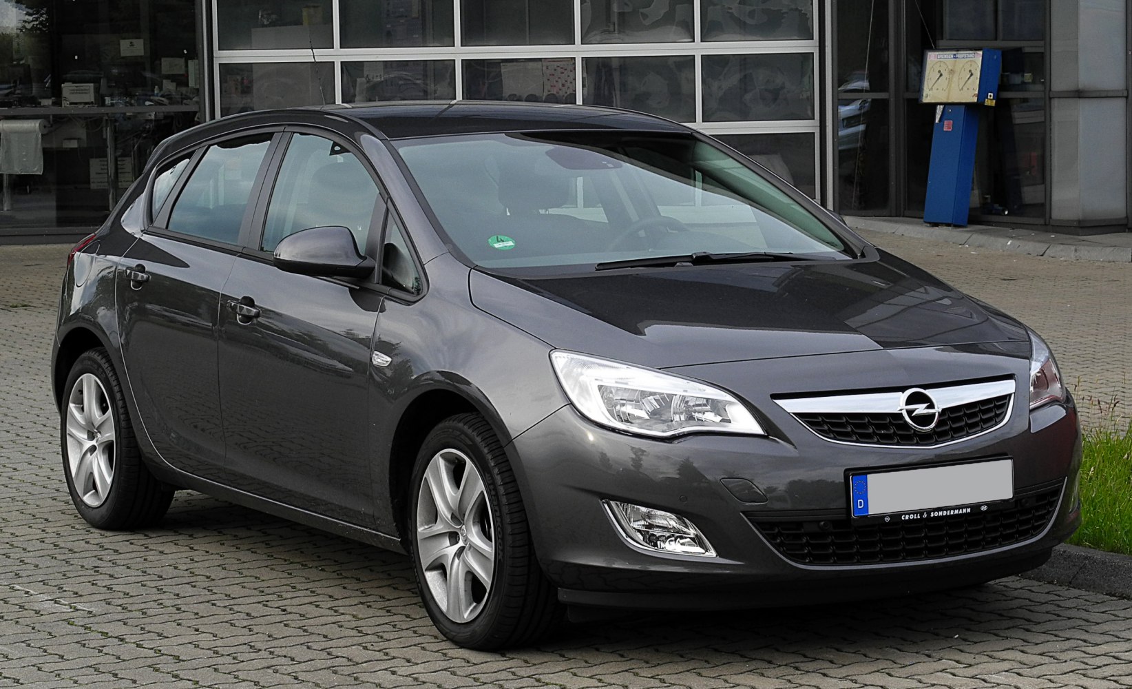 Compact hatchback front side with alloy wheels and headlights