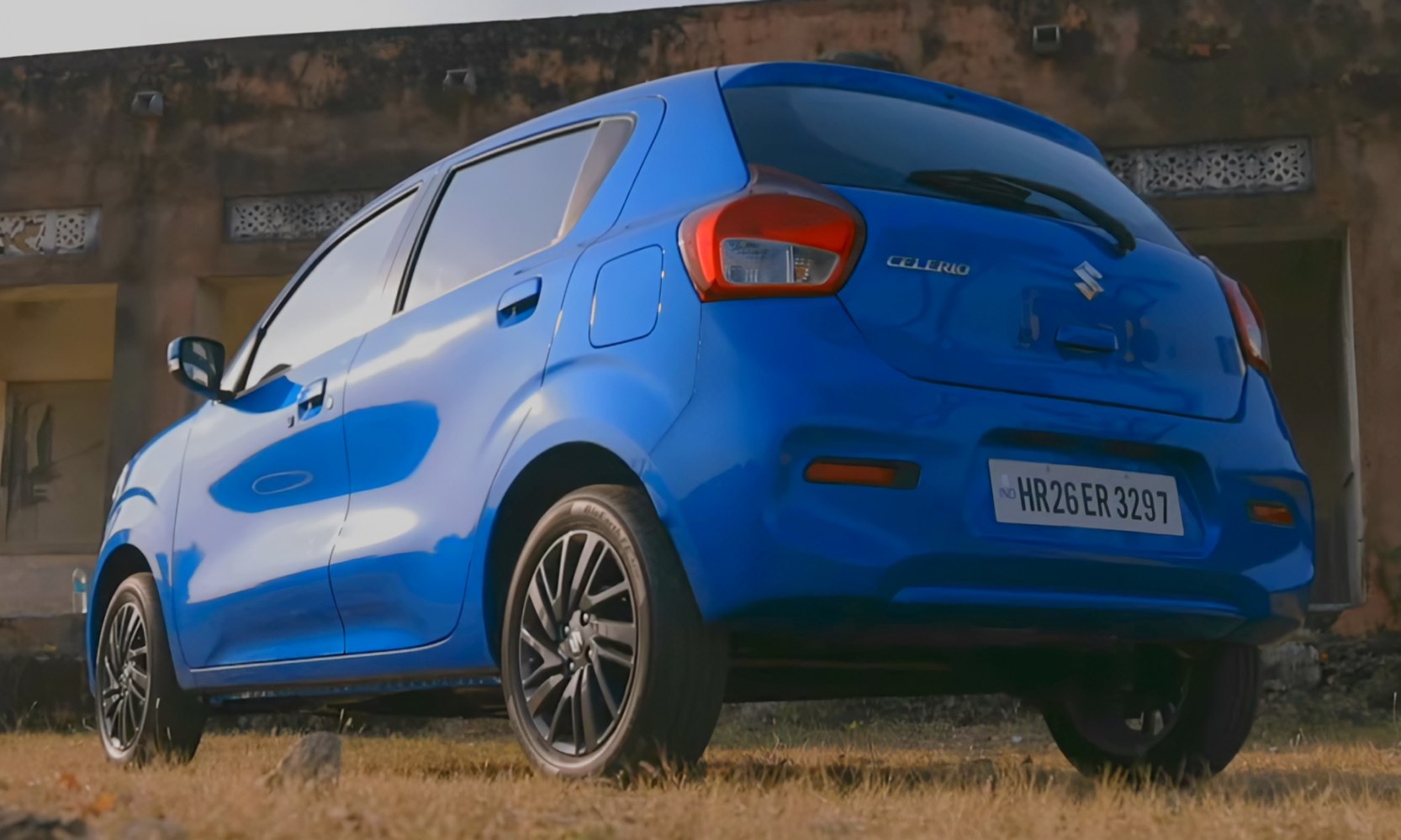 Rear-side view of compact hatchback with sporty alloy wheels