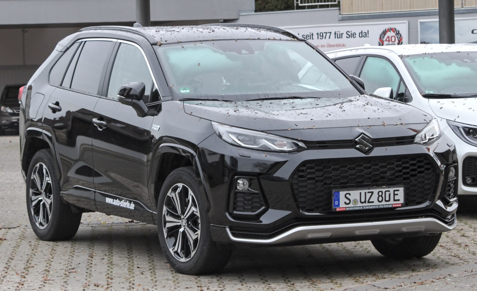 Front grille and alloy wheels of black SUV
