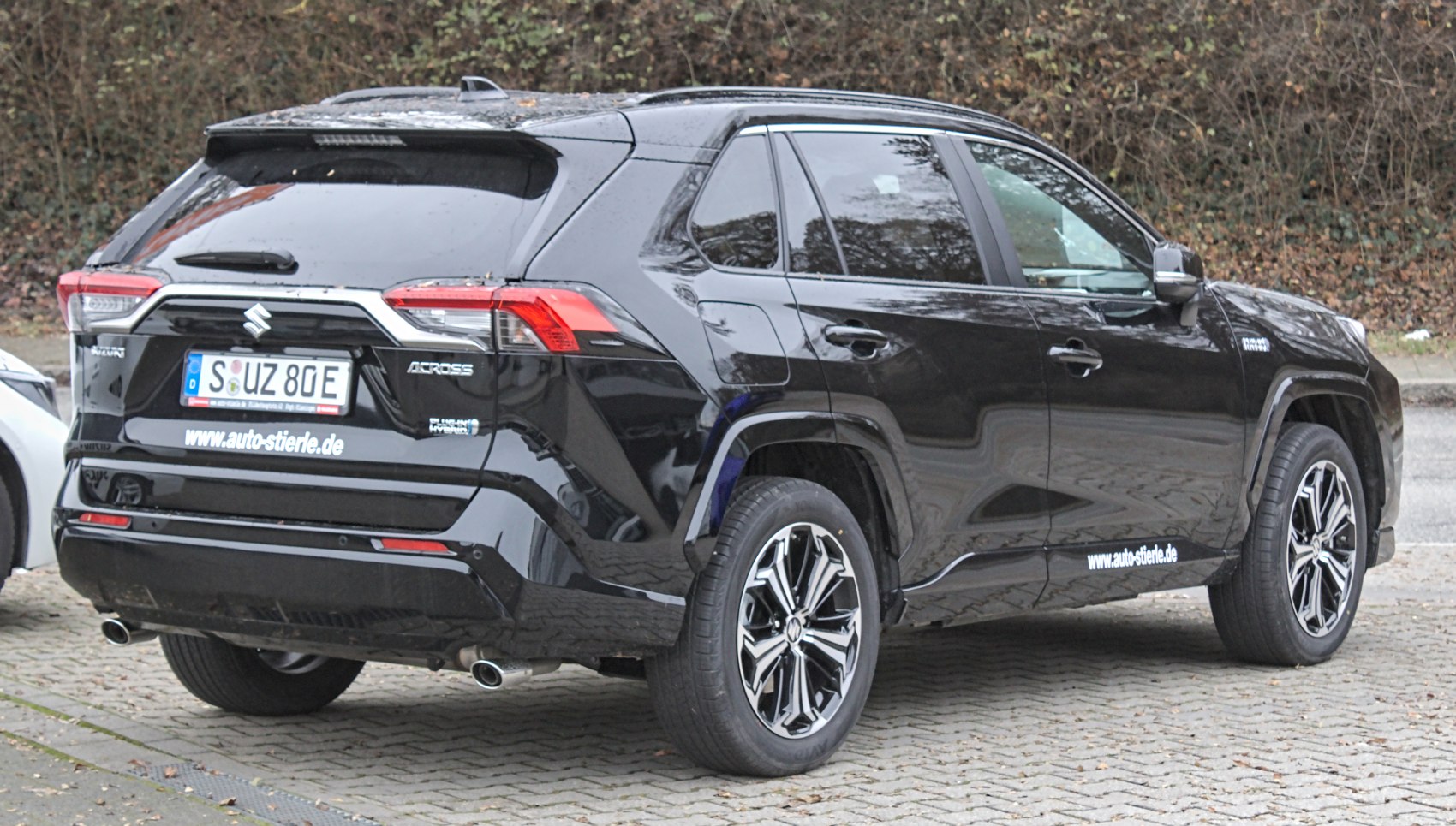 Rear and side view of a modern hybrid SUV with distinctive taillights and alloy wheels
